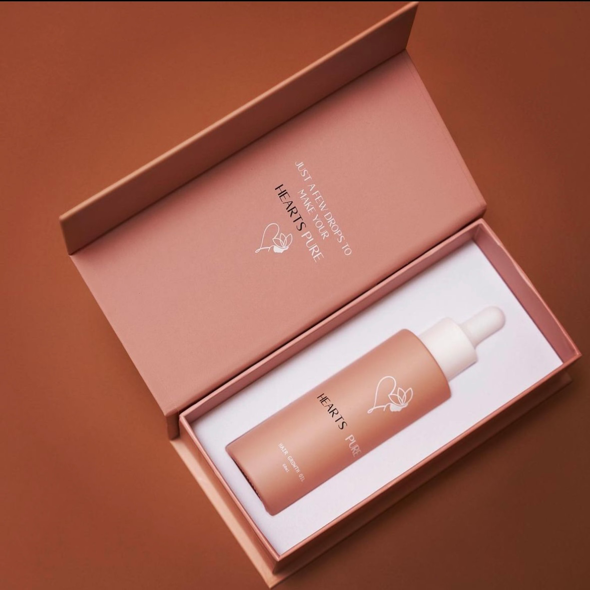 Hearts Pure Hair Growth Oil packaging front angle